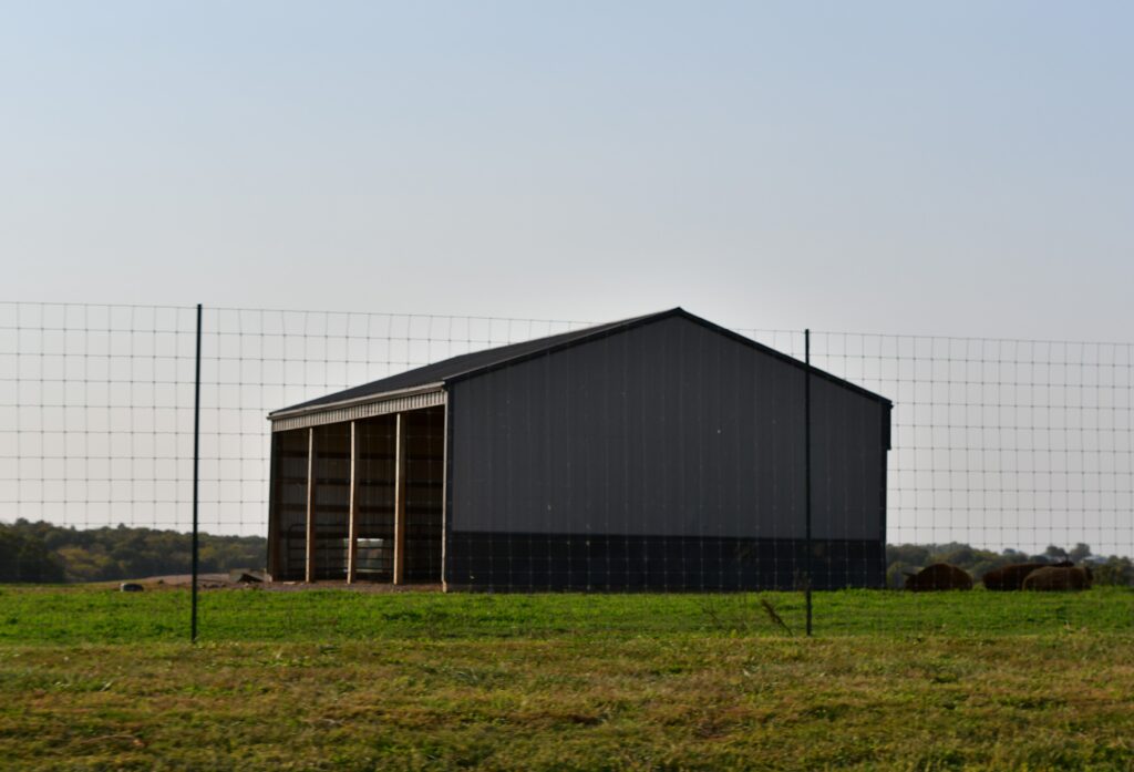 metal,barn,in,a,farm,field